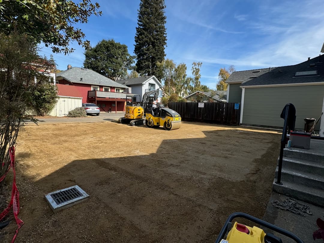 picture of a drum roller compacting dirt